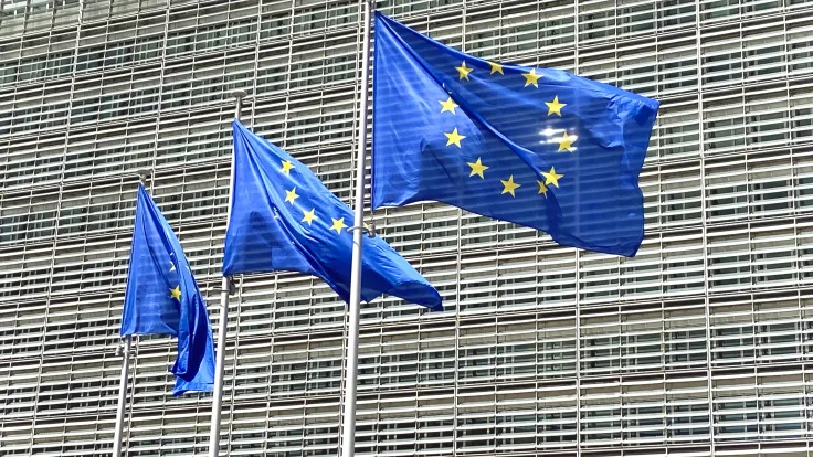 European flags fly before modern building facade 2026 09 24 08 13 53 utc