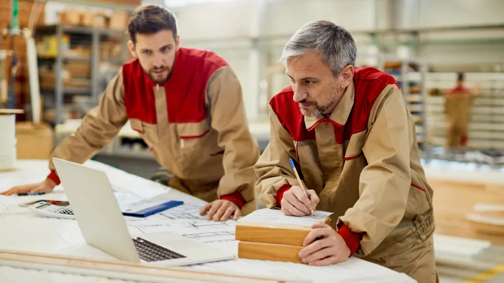 Two men working on laptop at industrial workplace 2026 09 21 14 05 27 utc